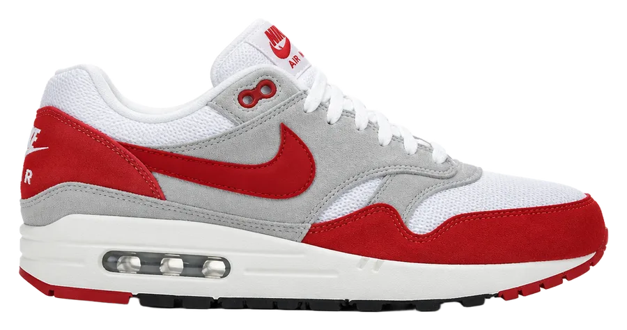 White, grey and red running sneaker with a visible air unit in the heel, side view
